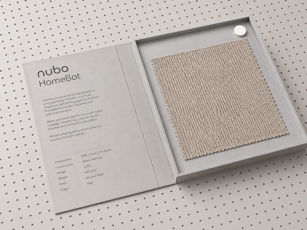 Nubo HomeBot fabric swatch displayed in a presentation box alongside a product specification card